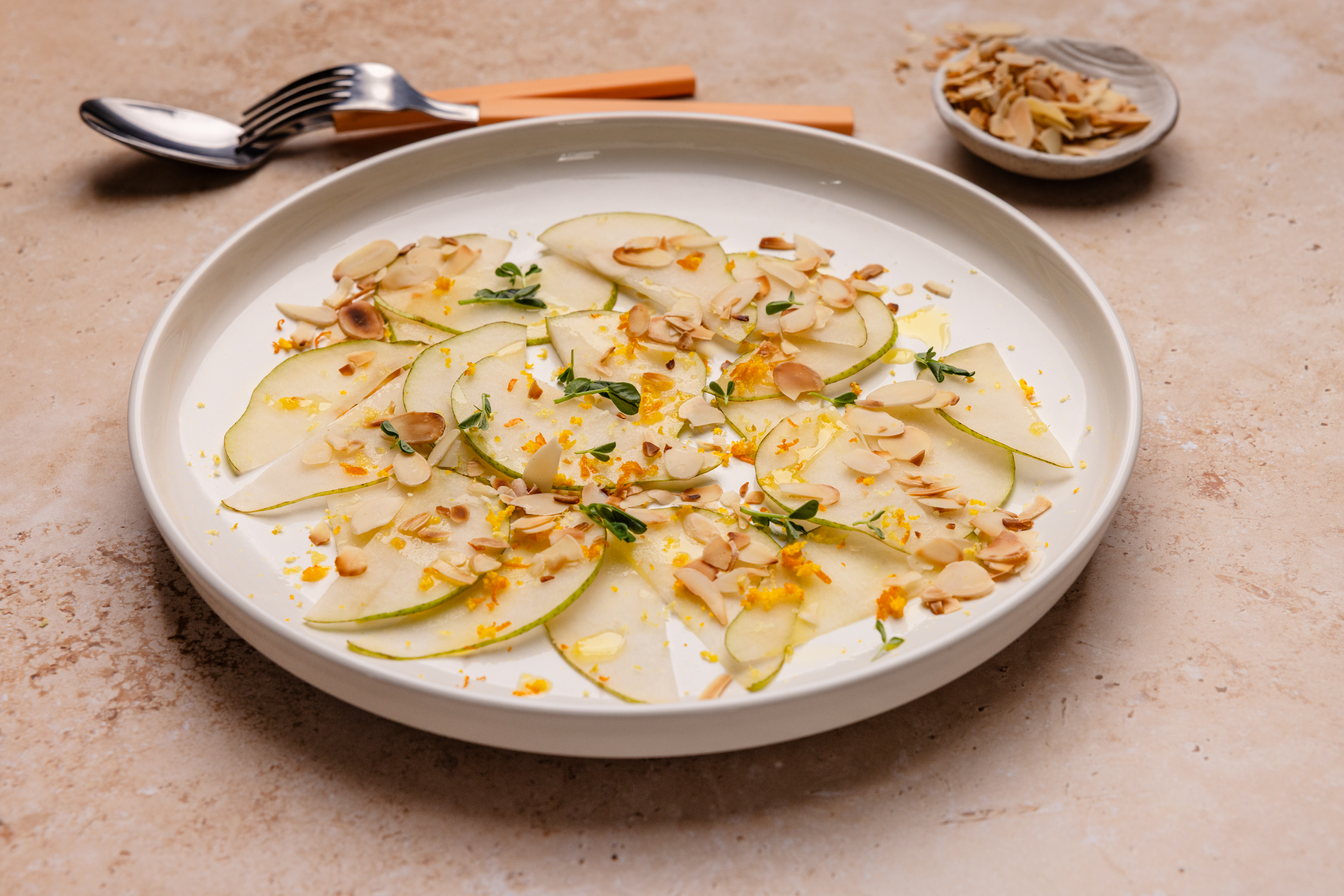Pear Carpaccio with Citrus, Olive Oil and Crunch